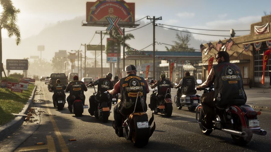 A large group of bikers riding down a highway past roadside signage