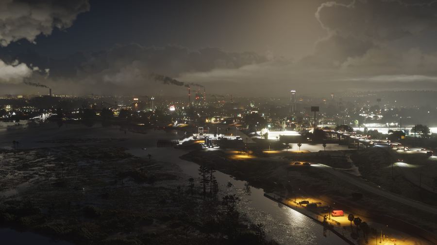 An industrial town at dusk under heavy cloud