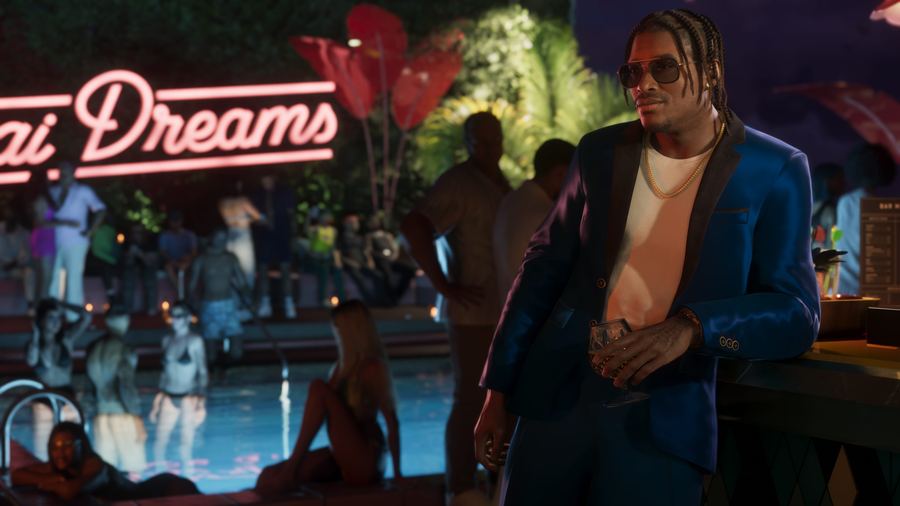 Dre'Quan Priest standing outside a neon-lit venue at night