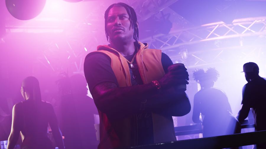 Dre'Quan Priest in a crowded nightclub filled with pink haze