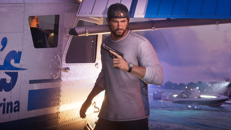 Jason Duval holding a shotgun at a marina in daylight