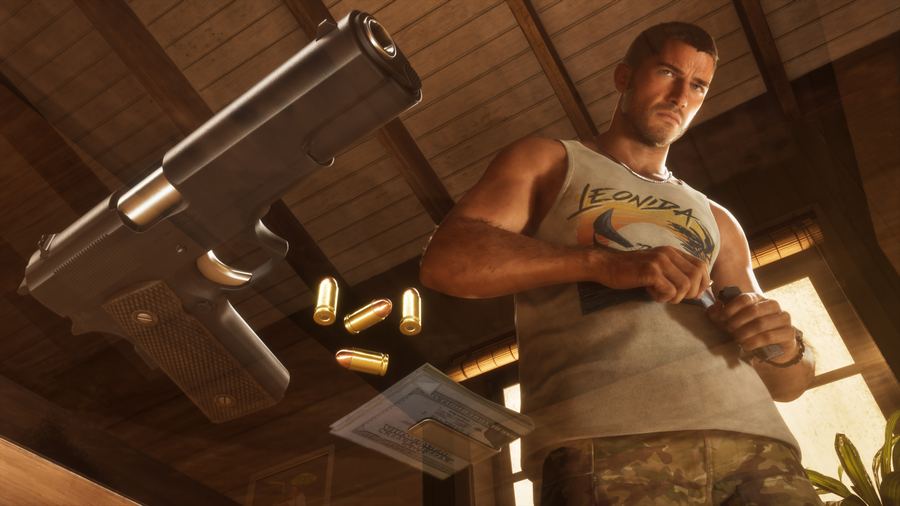 Close-up of a pistol and loose ammunition on a table in front of Jason Duval