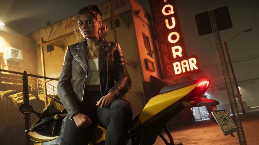 Lucia Caminos sitting inside a bar beneath a red neon liquor sign