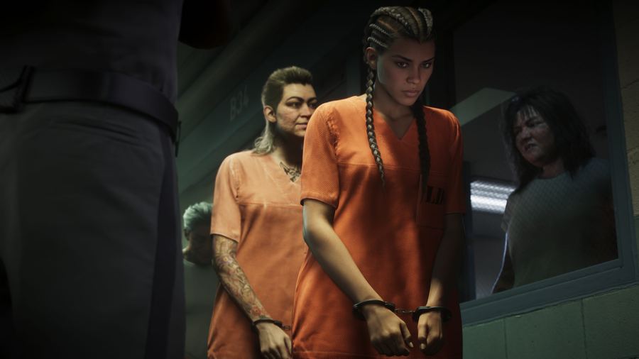 Lucia Caminos in an orange prison uniform, handcuffed and escorted by guards