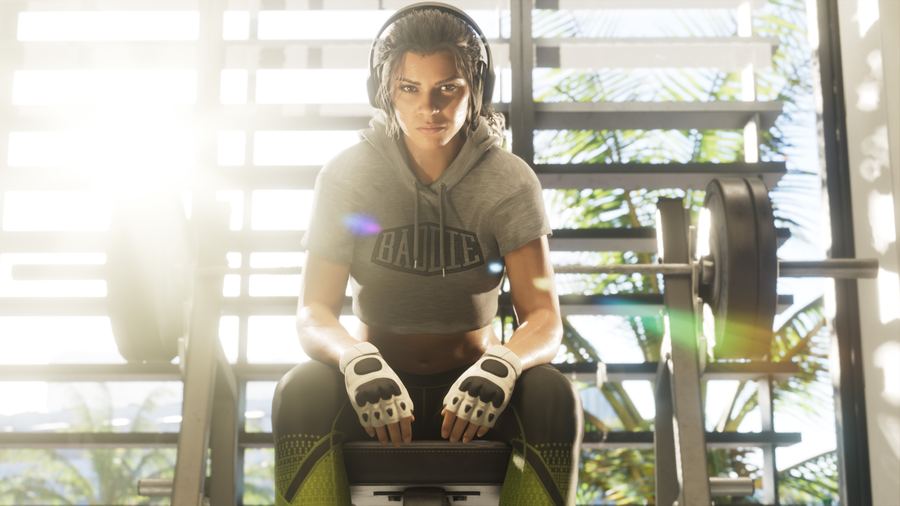 Lucia Caminos working out on a weight bench in a sunlit gym