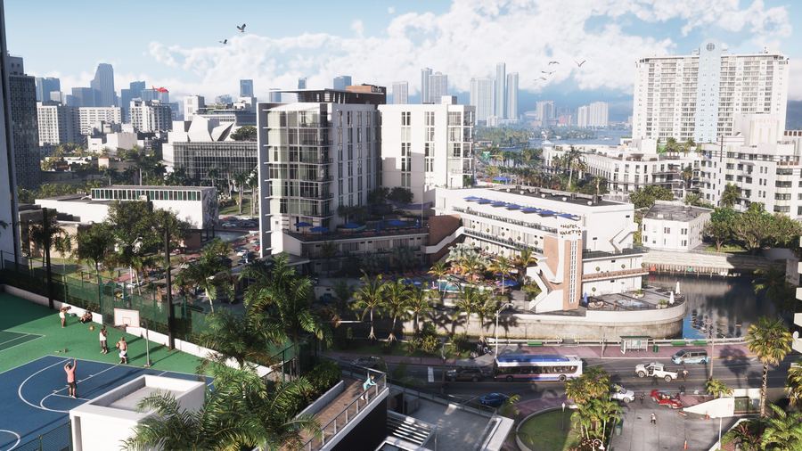 A daytime aerial view of dense Vice City apartment blocks and a basketball court